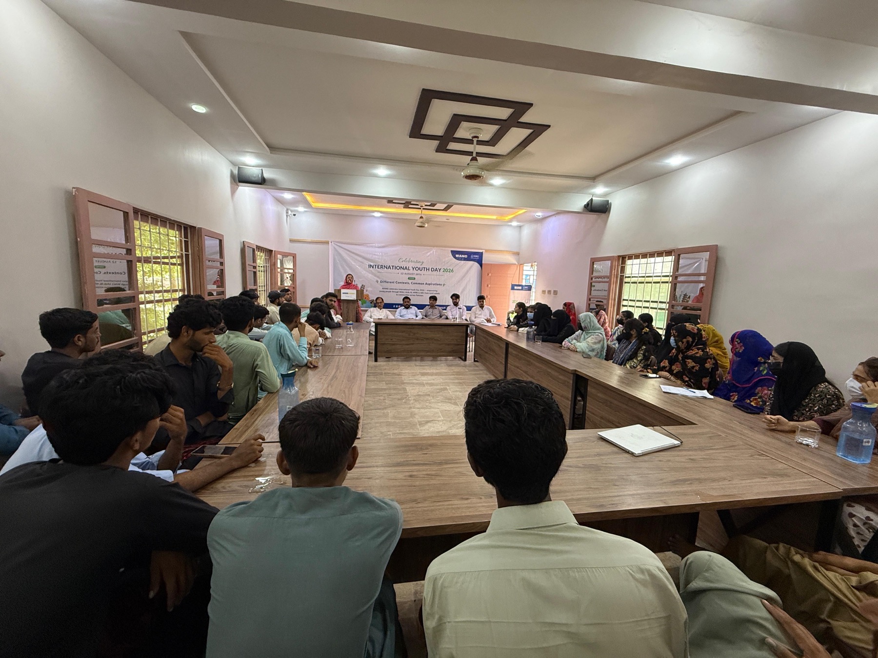 Young women and men gathered at WANG in Balochistan for International Youth Day 2026