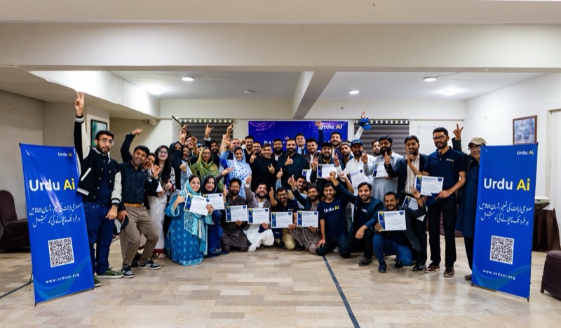 Urdu AI community workshop graduates holding certificates at a facilitated session in Pakistan