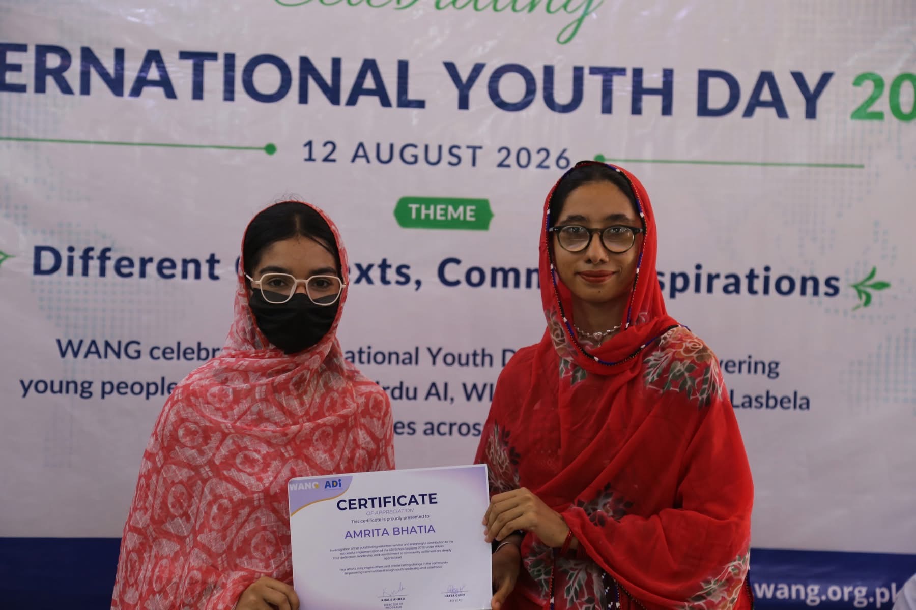 A WANG volunteer receiving a certificate of appreciation on International Youth Day 2026